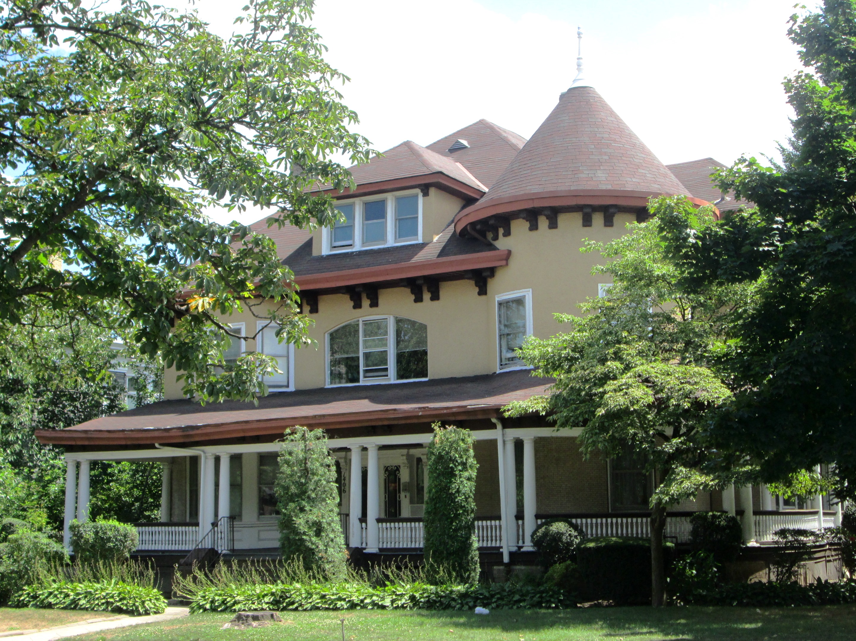 Flatbush Victorian: A distinctive single home with a turret, wraparound porch, expressive rooflines, and neighborhood character.